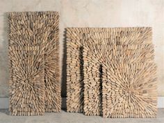 two pieces of art made out of wood sticks