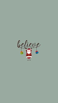 a christmas card with the words believe and santa clause hanging from a line on it