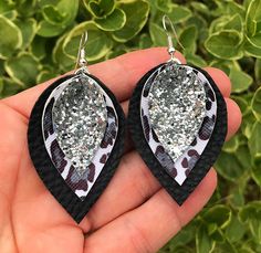 "Made with White & Black Leopard, Black & Silver Glitter Faux Leather. Measures 2\" L x 1 1/4\"W. Super Lightweight! Silver Plated Nickel Free Hardware. Looks Stunning On!" Black Glitter Jewelry For Party, Leopard Black, Faux Leather Earrings, Glitter Earrings, Jewelry Making Tutorials, Black Leopard, Leather Earrings, Silver Glitter, Teardrop Earrings