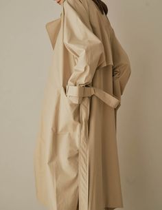 A cool variation of the classic trench, the Lotte Trench features a relaxed, slouchy silhouette with cinchable waist and wrists, rounded shoulders, and deep patch pockets. Also available in dark beige. - Overcut- Pointed collar- Top button closure- Half storm front and back- Removable storm neck piece- Belted waist and cuffs- Angled patch pockets- Back vent- Fully lined- Measurements Length 45.5", Bust 52", Sleeve 31.5"- Outer: 100% Cotton, Lining: 100% Polyester- Dry clean- Imported Trench Lighter, Rounded Shoulders, Neck Piece, Dark Beige, Collar Top, Measurement Length, Light Beige, Horn, Duster Coat