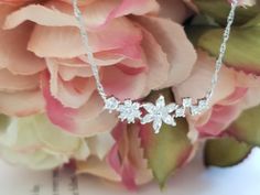 "CZ Necklace, Cubic Flower Necklace, Flower pendant, Spring jewerly/ Flower Girl gift/ everyday jewelry ✦ Pendant cubic zirconia,16K gold plated - Size:30x11mm including links ( flower) ✦ Gold Figaro Chain, Rhodium Figaro Chain ✦ Length: The length is 16\"+2.5\" extender chain ✦ Beautifully gift wrapped in a gift box with a ribbon." Cubic Zirconia Flower Charm Necklace For Wedding, Flower Shaped Cubic Zirconia Jewelry Gift, Flower Shaped Cubic Zirconia Necklace For Anniversary, Flower-shaped Cubic Zirconia Necklace For Anniversary, Flower Shape Jewelry With Sparkling Stones For Gifts, Flower Shaped Jewelry With Sparkling Stones For Gifts, Flower-shaped Jewelry With Sparkling Stones For Gift, Flower Shaped Sparkling Stones Jewelry For Gifts, Flower Shaped Sparkling Stones Jewelry Gift