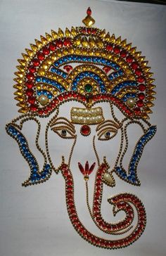 the head of an elephant is made out of beads and glass bead work on white paper