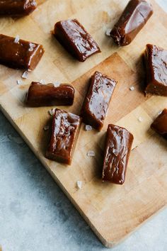 pieces of chocolate on a wooden cutting board