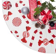 a table topped with lots of candy and candies on top of a white plate