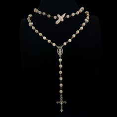 Follow @cherubtrove on Instagram for latest products and more information. ꣑ৎ Handmade goth cross necklace with glass pearls, baroque freshwater pearls, silver details & a silver cross charm. Adjustable length. Introducing our stunning silver cross necklace, a perfect blend of style and spirituality. This handmade necklace features a unique design that captures the essence of y2k grunge jewelry, making it an ideal accessory for anyone looking to express their individuality. With its gorgeous white pearl rosary and intricate silver cross pendant, this gothic rosary can not only be a religious necklace but also a fashionable piece of art. Whether you're layering it with other punk necklaces or wearing it alone, this one-of-a-kind pearl cross necklace will elevate your style. Beautiful silver Beeded Cross Necklace, Grunge Jewelry Necklaces Pearl, Hand Made Cross Necklace, Goth Cross, Pearl Cross Necklace, Goth Necklace, Grunge Jewelry, Pearl Rosary, Silver Cross Necklace