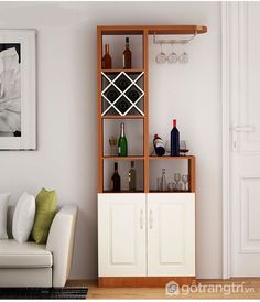 a living room filled with furniture and wine glasses on top of it's shelves