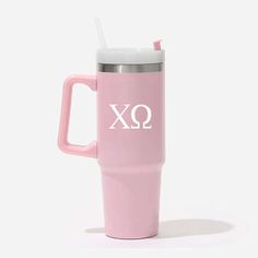 a pink travel mug with the word xo on it and a straw sticking out