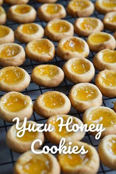 some cookies with honey on top and the words yuzu honey cookies