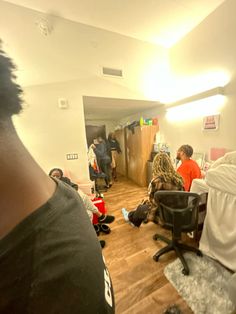 a group of people sitting around in a room