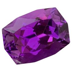 Faceted Amethyst Weight: 7.85 Carats Origin: Brazil Shape: Long Cushion Color: Purple Certficate: On Customer Demand . Amethyst is a captivating gemstone renowned for its striking purple hues and rich history. This violet to purple variety of quartz has captivated human imagination for centuries, with its name originating from the Greek word "amethystos," which means "not drunk." The ancient Greeks believed that wearing amethyst jewelry or drinking from amethyst cups would protect them from intoxication. Amethyst's alluring color ranges from pale lilac to deep violet, often displaying bands of varying shades. This gemstone's vivid coloration is attributed to the presence of iron and aluminum impurities within the crystal lattice. The finest amethysts exhibit a deep, royal purple hue, makin Prisma Hexagonal, Crystal Lattice, Long Cushion, Pale Lilac, Purple Amethyst Ring, Color Violeta, Volcanic Rock, Greek Words, Amethyst Jewelry