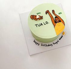 a birthday cake with an image of a woman doing yoga