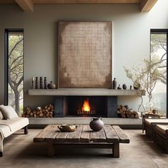 a living room filled with furniture and a fire place in the middle of the room