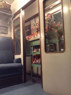 the inside of a train car with shelves full of items