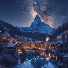 the night sky is lit up over a mountain village and lake with lights on it