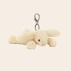 A mini bunny stuffed animal on a silver keychain. Cute Plushie Keychains, Jellycat Keychain Aesthetic, Bunny Jelly Cat Keychain, Jelly Cat Keychain, Jellycat Keychain, Stuffed Keychain, Y2k Items, Jelly Cat, Wishlist Ideas