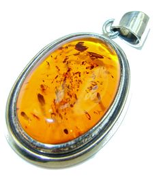 Handmade Unique 925 Sterling Silver pendant with unique one of a kind Amber,  10.50 grams of marvelous handcrafted jewelry design. Only one piece availble ready to ship! It's unique worldwide pendant - simply piece of art in world of fine jewelry. Natural Golden Amber  .925 Sterling Silver handmade Pendant  PENDANT DETAILS: Weight: 10.50g; Material: Sterling Silver; Main stone: Amber; Dimension: L- 2, W- 1, T- 3/8 inch; Inner Bail Diameter: 1/4 inch; Stamp / Mark: 925; Condition: New; Main color Handmade Amber Sterling Silver Jewelry, Artisan Amber Sterling Silver Jewelry, Amber Sterling Silver Round Pendant Jewelry, Unique Amber Sterling Silver Jewelry, Handmade Amber Oval Pendant Jewelry, Antique Amber Sterling Silver Jewelry, Amber Antique Sterling Silver Jewelry, Antique Amber-colored Sterling Silver Jewelry, Unique Amber Jewelry Stamped 925