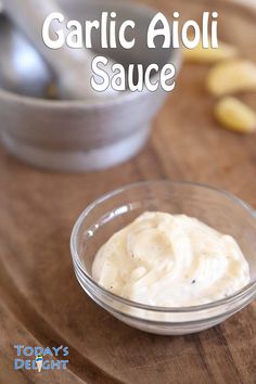 garlic aioli sauce in a glass bowl on a wooden table