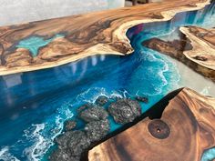 the table is made out of wood and blue water