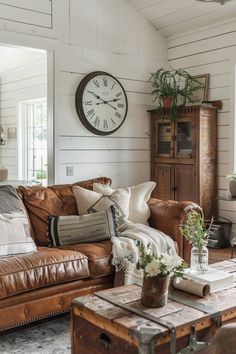 a living room filled with furniture and a clock on the wall