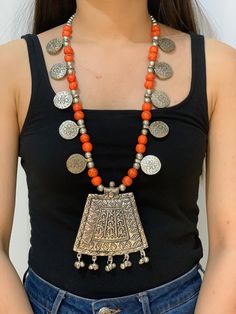 Beautiful crafted long coin design necklace . Made out of orange colour resin beads  And very light aluminium pendant    Length of the necklace - 17 inch  Length of a pendant.   - 3 and a half inch Bohemian Orange Necklaces With Silver Beads, Orange Round Pendant Necklace, Wedding Necklaces, Coin Design, Orange Colour, Wedding Jewellery Necklace, Resin Beads, Coin Necklace, Wedding Necklace