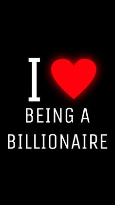 the words i love being a billionaire are lit up in front of a red heart