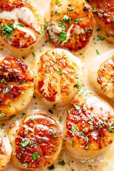 some kind of food that is on top of a pan with sauce and parmesan cheese