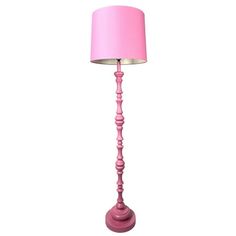 a pink floor lamp on a white background