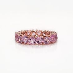 14K rose gold heart shape pink sapphire band ring.  Approximately 4.32ctw Luxury Pink Heart Cut Ring, Luxury Pink Heart Ring For Anniversary, Luxury Pink Heart Ring For Valentine's Day, Pink Wedding Band, Pink Diamond Wedding Rings, Pink Diamond Band, Heart Eternity Ring, Sapphire Band Ring, Pink Sapphire Band