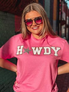 This Pink T-Shirt is a real HOWDY to the wild, wild west. This cute chenille howdy is sure to turn heads and keep you looking stylish and girly all day. Yee-haw! Unisex sizing and fit SPECIAL CARE - WASHING INSTRUCTIONS: Hand washing and air drying are always best for these items. Wash on delicate, cold, and inside out. Always air dry to prevent lint from sticking to the letters and for longevity of your beautiful items! Chenille Letter Shirts, Pink Short Sleeve Western Top, Trendy Tops For Country Concerts, Initial Sweatshirt, Howdy Shirt, Patch Ideas, Wild Wild West, Diy Shirts, Trendy Shirt Designs