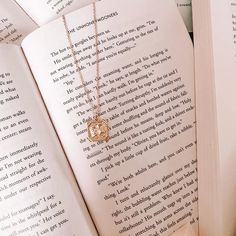 Classic everyday jewelry but make it bookish!This beautiful gold necklace features an open book with a bouquet of wildflowers. It's minimal but elegant and perfect for book lovers. The necklace comes with our microfiber pouch so you can always keep it safe and secure. The necklace chain is 16" long with a 3" extender. The book pendant is 15mm x 15mm. Bouquet Of Wildflowers, Book Pendant, An Open Book, Book Necklace, Beautiful Gold Necklaces, Style Aesthetic, Open Book, Comfort Colors Tee, Everyday Jewelry