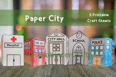 paper city craft sheets are arranged on a wooden table with text overlay that reads, 5 printable craft sheets