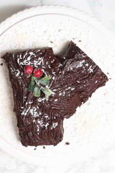 a piece of chocolate cake on a white plate