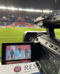 a video camera recording a soccer game