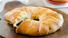 a close up of a pastry on a plate with a knife