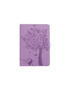 a purple notebook with an image of a tree on the front and butterflies on the back