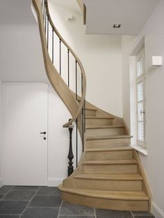 a staircase in a house with tile flooring