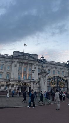 people walking in front of the royal palace