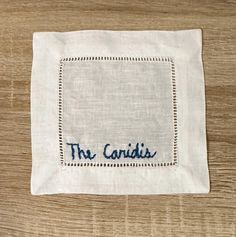 a napkin with the words the candids embroidered on it