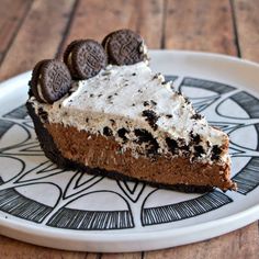 a slice of chocolate oreo pie on a plate with an oreo cookie crust