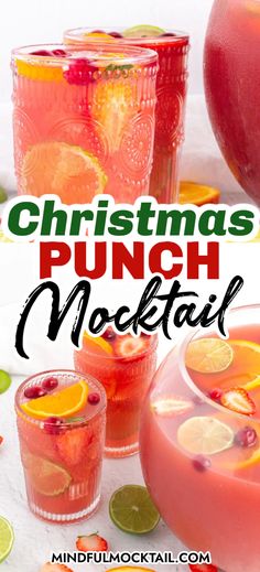 christmas punch mocke with oranges and limes in glasses next to it on a table