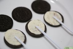 oreo cookies and marshmallows on a white plate