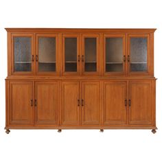 a large wooden cabinet with glass doors