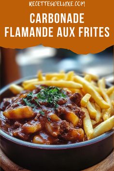 a bowl filled with french fries covered in chili and sauce next to a wooden cutting board