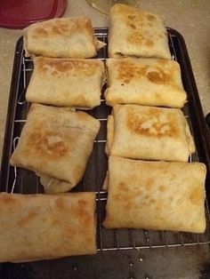 some food is sitting on a cooling rack and ready to be cooked in the oven