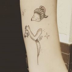 a woman's arm with a tattoo on it and an image of a ram