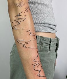 a man with a tattoo on his arm that has words written in different languages and shapes