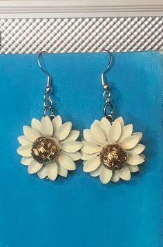 Add a boho charm to your look with the White Wildflower Dangly Earrings. Materials: Plastic, Alloy, Sterling Silver Earring length: 2 in Earrings Outfit, Silver Ornaments, Halo Earrings, Floral Accessories, Earrings White, Dangly Earrings, Silver Earring, Earrings Etsy, Leaf Earrings