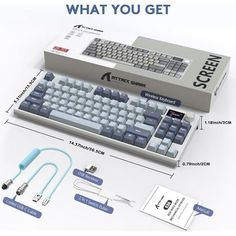 a computer keyboard sitting on top of a table next to other electronic devices and accessories