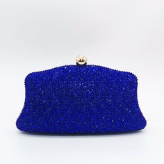 Indulge in the celestial allure of the Jane Crystals Clutch Bag – a shimmering masterpiece from every angle. Bedazzled with sparkling crystals, this handbag commands attention as a captivating statement piece. Its mesmerizing design guarantees all eyes gravitate towards you as you make your grand entrance. And with the addition of a chic chain strap, you can effortlessly carry it while dancing the night away, exuding sophistication with every step. Exclusively available in blue. Crystal Clutch Bag For Events, Glamorous Crystal Rectangular Evening Bag, Sparkling Clutch For Night Out, Sparkling Crystal Evening Bag For Events, Sparkling Crystal Bags For Party, Evening Crystal Bag In Rectangular Shape, Crystal Evening Bag, Rectangular Shape, Evening Crystal Rectangular Bag, Evening Bags With Crystal Material