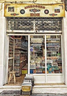 an old store front with many books on display